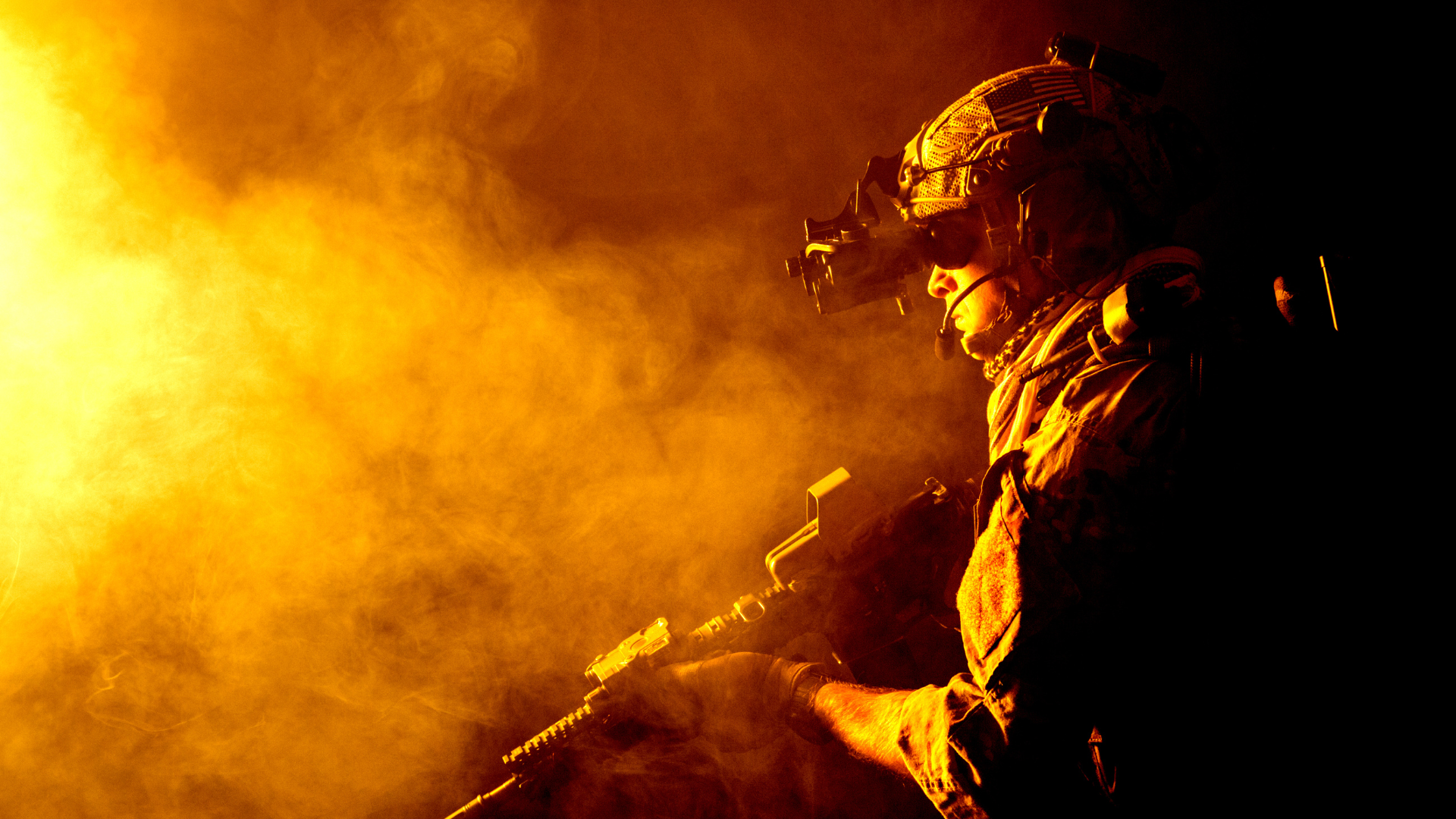 night vision soldier standing in smoke and he is looking through night vision